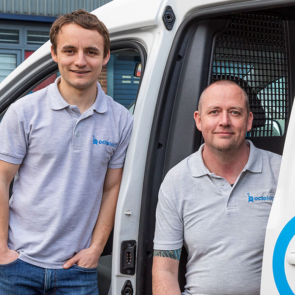 Portrait shot of Matt and Nick, the founders of Octotech outsite the Horsham support centre by the Octotech branded van.